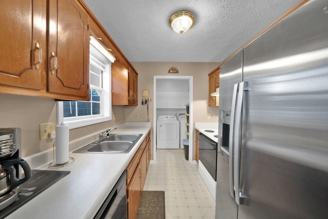 2879 Chinquapin Ln, Clarksville, TN 37043 - kitchen with stainless steel refrigerator with ice dispenser, a sink, washer and clothes dryer, light flooring, and light countertops
