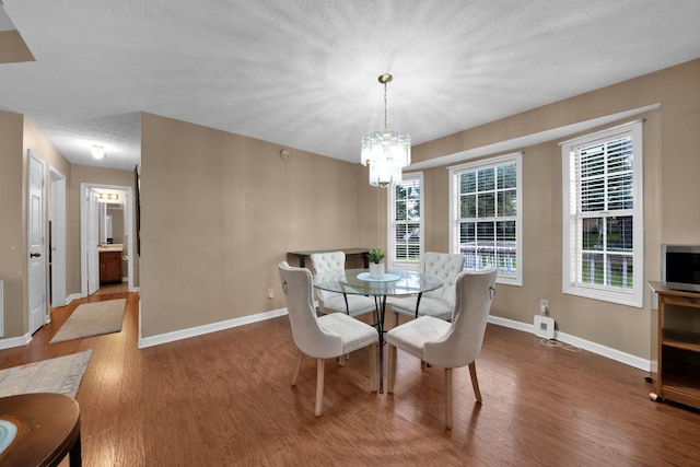 2879 Chinquapin Ln, Clarksville, TN 37043 - dining space with wood finished floors, baseboards, and a chandelier