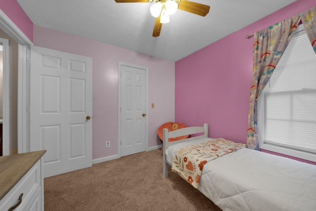2879 Chinquapin Ln, Clarksville, TN 37043 - bedroom featuring light carpet, a textured ceiling, baseboards, and a ceiling fan