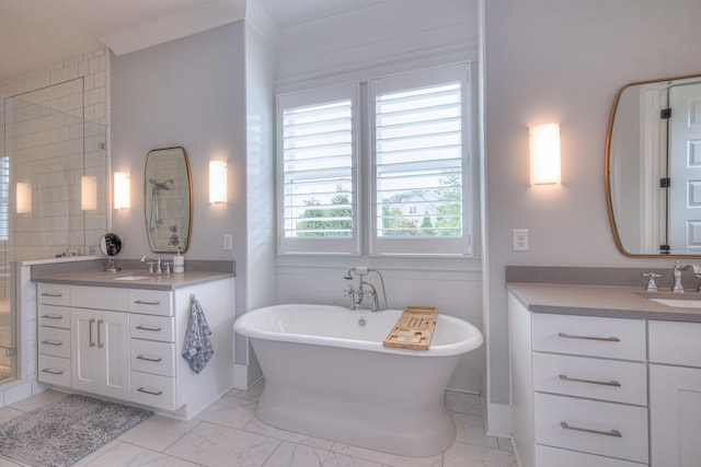 2117 Southern Preserve Ln, Franklin, TN 37064 - full bath featuring a soaking tub, two vanities, marble finish flooring, and a tile shower