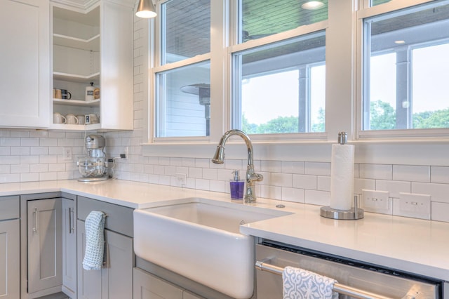 2117 Southern Preserve Ln, Franklin, TN 37064 - kitchen with dishwashing machine, gray cabinets, light countertops, and backsplash