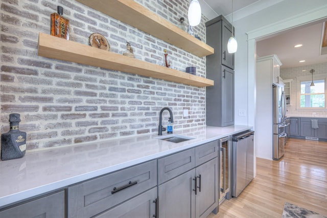 2117 Southern Preserve Ln, Franklin, TN 37064 - kitchen featuring open shelves, gray cabinets, stainless steel appliances, light wood-style flooring, and hanging light fixtures