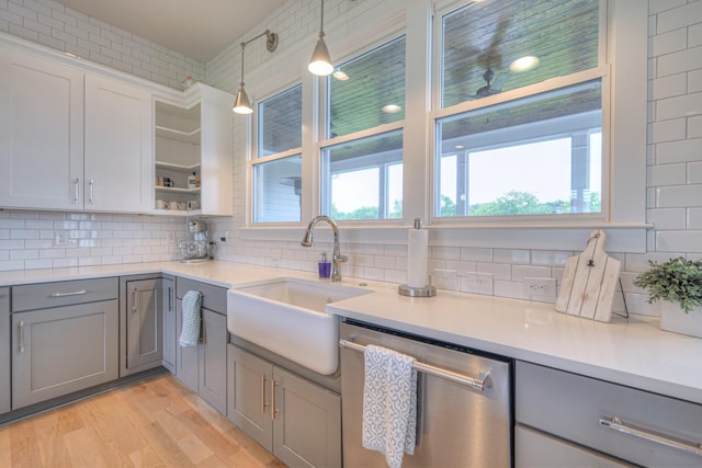 2117 Southern Preserve Ln, Franklin, TN 37064 - kitchen with stainless steel dishwasher, gray cabinets, open shelves, backsplash, and light wood finished floors