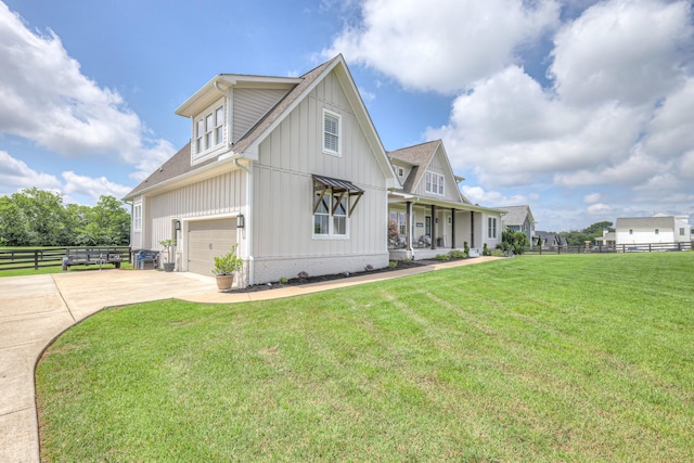 2117 Southern Preserve Ln, Franklin, TN 37064 - view of side of home with a porch, concrete driveway, board and batten siding, and roof with shingles