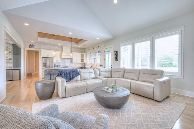 2117 Southern Preserve Ln, Franklin, TN 37064 - living room featuring light wood finished floors, recessed lighting, a raised ceiling, and vaulted ceiling