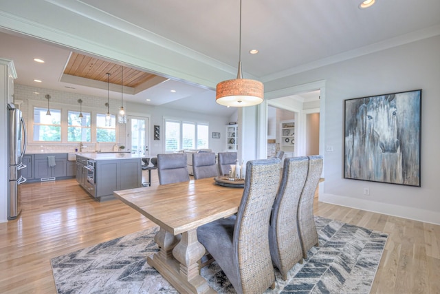 2117 Southern Preserve Ln, Franklin, TN 37064 - dining area with light wood-style flooring, recessed lighting, ornamental molding, and a tray ceiling
