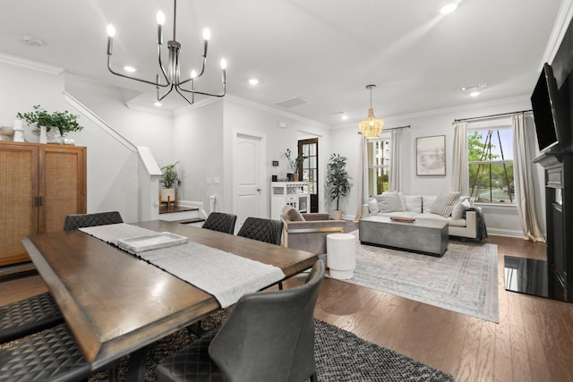 2122 Notchleaf Rd, Antioch, TN 37013 - dining space with a chandelier, wood finished floors, recessed lighting, crown molding, and baseboards