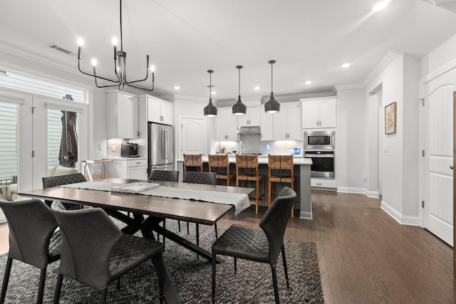 2122 Notchleaf Rd, Antioch, TN 37013 - dining room with crown molding, dark wood-type flooring, recessed lighting, a chandelier, and baseboards