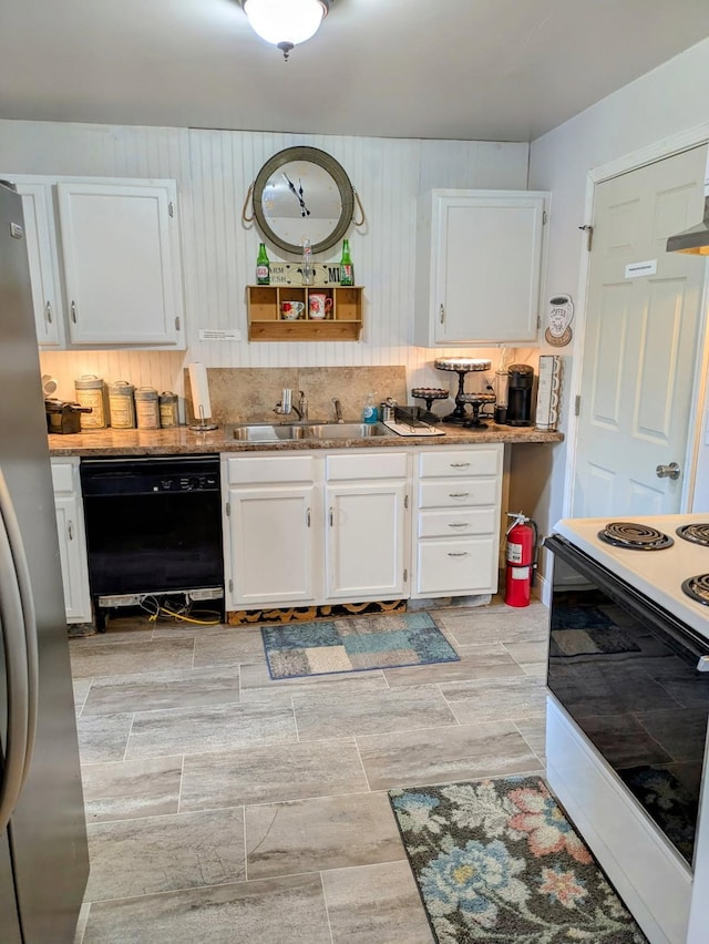 4250 Standing Rock Rd, Jamestown, TN 38556 - kitchen with dishwasher, a sink, electric stove, freestanding refrigerator, and white cabinetry