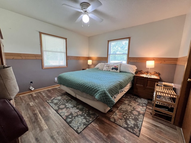 4250 Standing Rock Rd, Jamestown, TN 38556 - bedroom featuring wood finished floors, wainscoting, and a ceiling fan