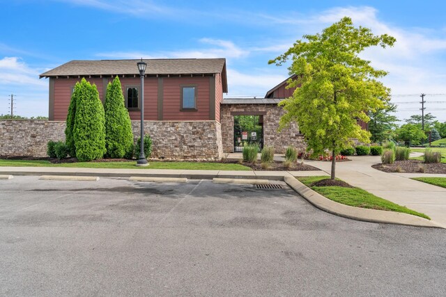 5073 Hunters Village Dr, Lebanon, TN 37087 - view of front facade featuring stone siding and uncovered parking