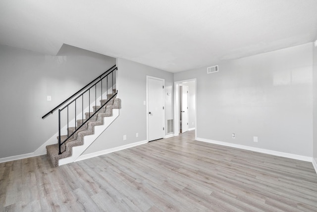361 Peabody Dr, Clarksville, TN 37042 - unfurnished living room with wood finished floors and stairway