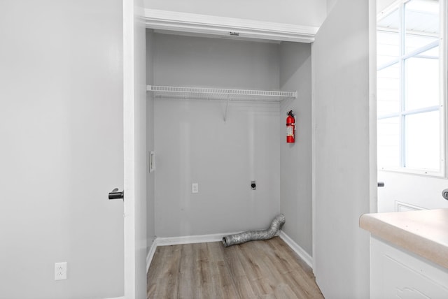 361 Peabody Dr, Clarksville, TN 37042 - laundry area with electric dryer hookup, light wood finished floors, and healthy amount of natural light