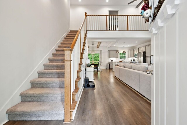 3650 Riggins Rd, Cumberland Furnace, TN 37051 - stairs featuring wood finished floors, a high ceiling, ceiling fan, and recessed lighting