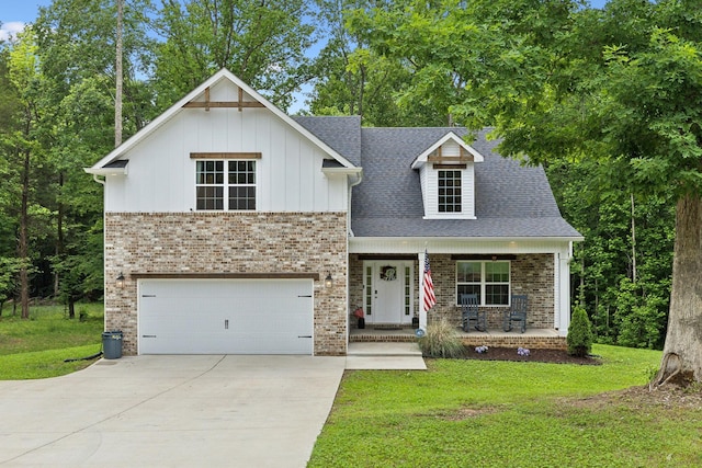 3650 Riggins Rd, Cumberland Furnace, TN 37051 - view of front of house with brick siding, concrete driveway, covered porch, an attached garage, and a front lawn