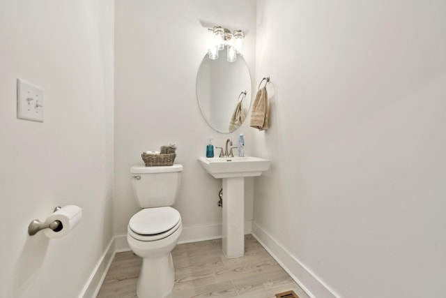 3650 Riggins Rd, Cumberland Furnace, TN 37051 - half bath featuring toilet, wood finished floors, and baseboards