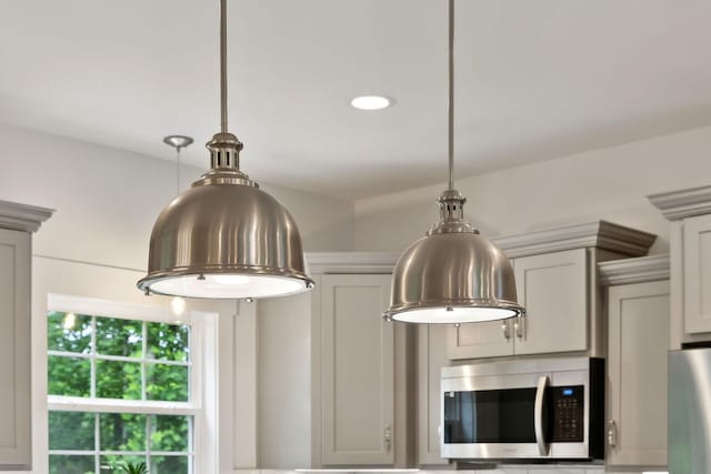 3650 Riggins Rd, Cumberland Furnace, TN 37051 - kitchen view of stainless steel appliances, decorative light fixtures, and recessed lighting