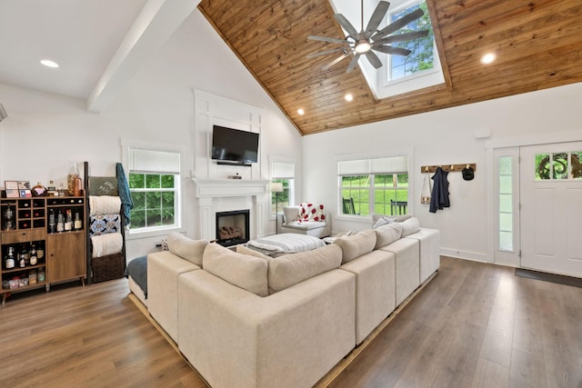 3650 Riggins Rd, Cumberland Furnace, TN 37051 - living room with high vaulted ceiling, ceiling fan, a skylight, recessed lighting, and wood finished floors