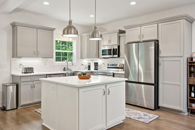 3650 Riggins Rd, Cumberland Furnace, TN 37051 - kitchen featuring appliances with stainless steel finishes, gray cabinets, a sink, decorative backsplash, and recessed lighting