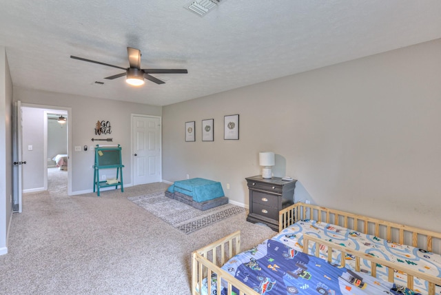 1713 Hollow Oak Dr, Lebanon, TN 37087 - bedroom featuring carpet, baseboards, ceiling fan, and a textured ceiling