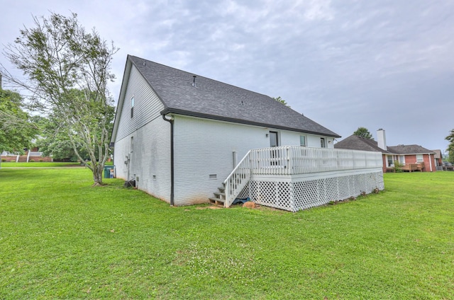 1713 Hollow Oak Dr, Lebanon, TN 37087 - rear view of house with a lawn, a deck, brick siding, roof with shingles, and stairs