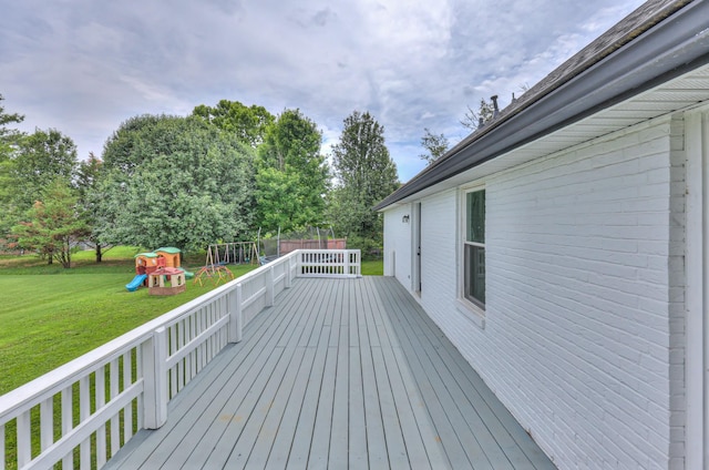 1713 Hollow Oak Dr, Lebanon, TN 37087 - wooden terrace featuring a playground, a yard, and view of scattered trees