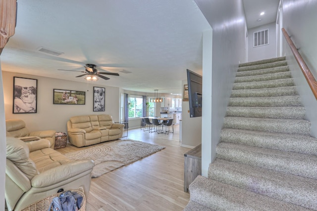 1713 Hollow Oak Dr, Lebanon, TN 37087 - living area featuring stairs, ceiling fan, and light wood-style flooring