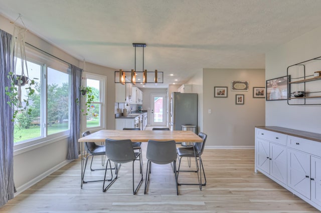1713 Hollow Oak Dr, Lebanon, TN 37087 - dining room with light wood-style floors, baseboards, plenty of natural light, a textured ceiling, and recessed lighting