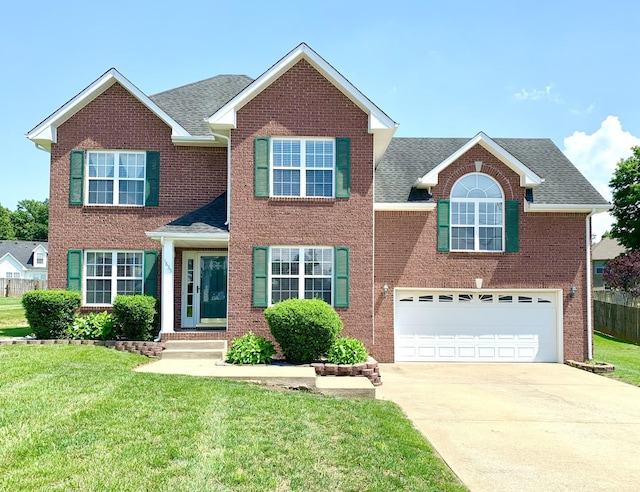 1635 Barrywood Cir E, Clarksville, TN 37042 - traditional home featuring concrete driveway, roof with shingles, and a front yard