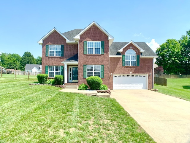 1635 Barrywood Cir E, Clarksville, TN 37042 - view of front facade featuring a garage, concrete driveway, brick siding, and roof with shingles