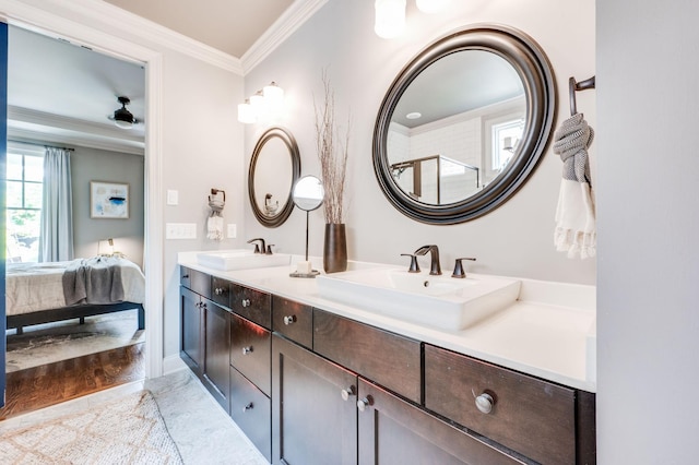 134 Fitzgerald St, Franklin, TN 37064 - ensuite bathroom featuring crown molding, double vanity, and baseboards