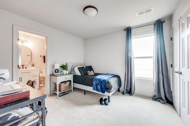 134 Fitzgerald St, Franklin, TN 37064 - bedroom with light colored carpet and ensuite bath