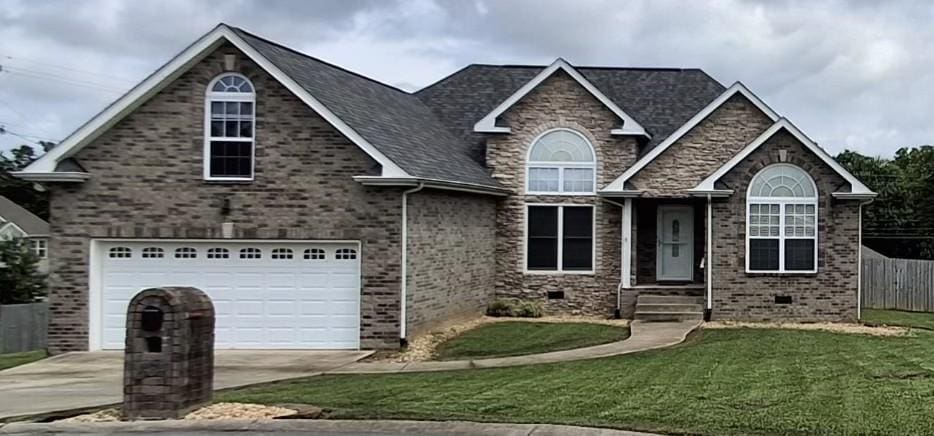 564 Callie Ct, Gallatin, TN 37066 - craftsman-style house featuring driveway, an attached garage, and brick siding