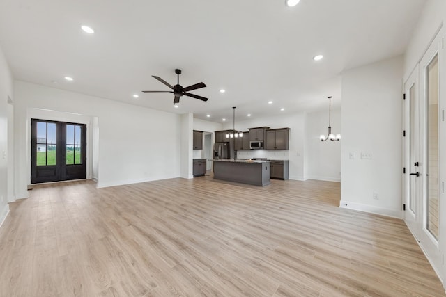338 Dugout Rd, Summertown, TN 38483 - unfurnished living room with ceiling fan, baseboards, a chandelier, recessed lighting, and french doors