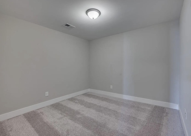 135 Grandstand Blvd, Gallatin, TN 37066 - spare room featuring light colored carpet and baseboards