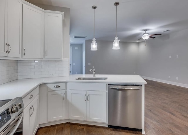 135 Grandstand Blvd, Gallatin, TN 37066 - kitchen featuring stainless steel appliances, a sink, ceiling fan, a peninsula, and light countertops