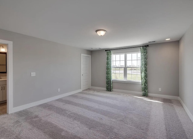 135 Grandstand Blvd, Gallatin, TN 37066 - spare room featuring light colored carpet and baseboards