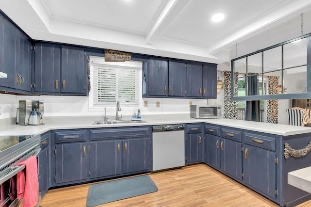 130 Shane Lee Cir, Dover, TN 37058 - kitchen with stainless steel appliances, a sink, blue cabinetry, a peninsula, and light countertops