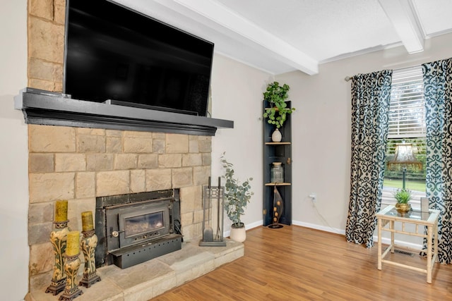 130 Shane Lee Cir, Dover, TN 37058 - living room featuring beamed ceiling, wood finished floors, a fireplace, and baseboards