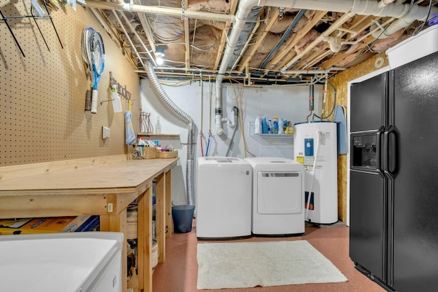 130 Shane Lee Cir, Dover, TN 37058 - unfinished below grade area featuring washer and dryer, water heater, and black fridge with ice dispenser