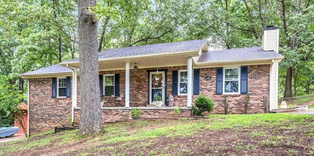 130 Shane Lee Cir, Dover, TN 37058 - single story home featuring a chimney, brick siding, a porch, and a shingled roof
