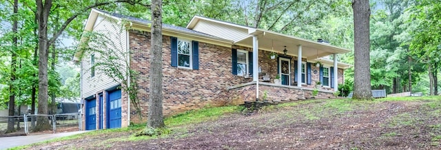 130 Shane Lee Cir, Dover, TN 37058 - ranch-style home with a porch, brick siding, driveway, and an attached garage