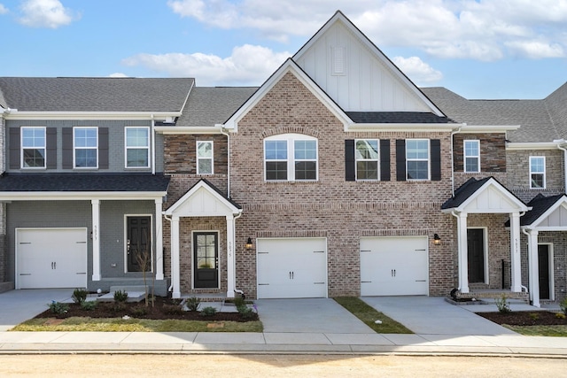 5046 Dayflower Dr, Hermitage, TN 37076 - view of front of house featuring board and batten siding, concrete driveway, brick siding, a garage, and a shingled roof