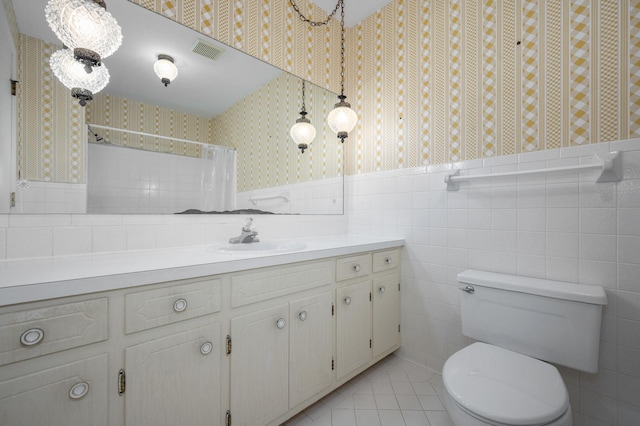2715 Clearview Ct, Murfreesboro, TN 37129 - bathroom with wallpapered walls, vanity, toilet, tile patterned flooring, and tile walls