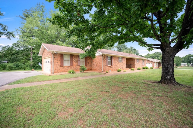 2715 Clearview Ct, Murfreesboro, TN 37129 - single story home with an attached garage, a front yard, asphalt driveway, and brick siding