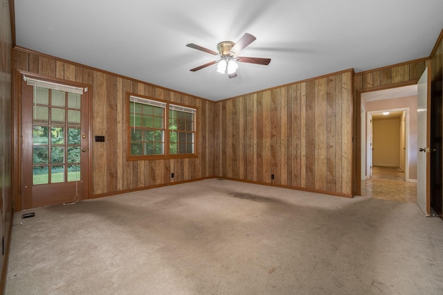 2715 Clearview Ct, Murfreesboro, TN 37129 - empty room with wood walls, light colored carpet, ceiling fan, baseboards, and crown molding