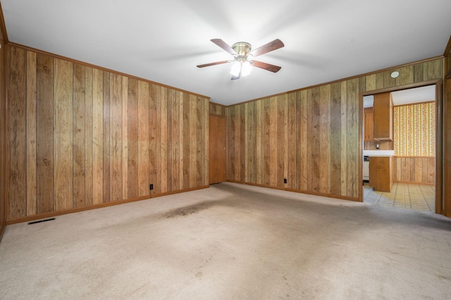 2715 Clearview Ct, Murfreesboro, TN 37129 - unfurnished room with wooden walls, ceiling fan, light colored carpet, and baseboards