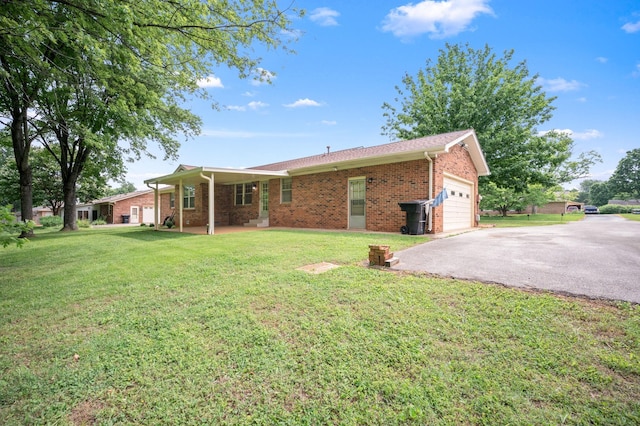 2715 Clearview Ct, Murfreesboro, TN 37129 - rear view of house featuring a garage, asphalt driveway, brick siding, and a yard