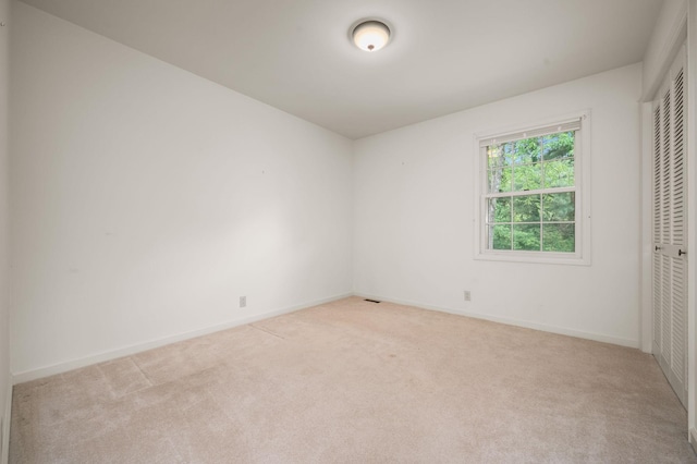 2715 Clearview Ct, Murfreesboro, TN 37129 - unfurnished bedroom with light carpet, a closet, and baseboards