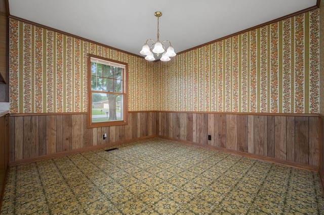 2715 Clearview Ct, Murfreesboro, TN 37129 - unfurnished room featuring a chandelier, wainscoting, crown molding, and wooden walls